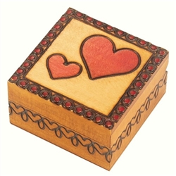 This small square box has one large heart Burned and painted on its lid, with a smaller heart beside it.  A border of hearts runs along the sides of the box. This beautiful box is made of seasoned Linden wood, from the Tatra Mountain region of Pola