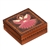 The lid of this beautiful wooden box is decorated with an angel design.