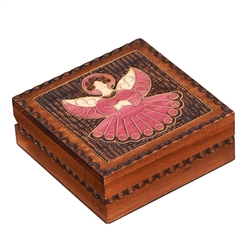 The lid of this beautiful wooden box is decorated with an angel design.