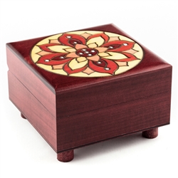 This unique wooden puzzle box has a lid that is decorated with a symmetrical maroon flower. Box has a secret opening by moving the legs.