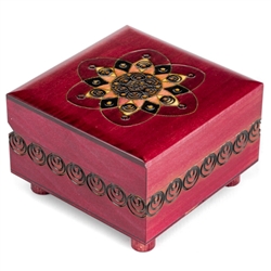 This puzzle box features an abstract, symmetrical design on the lid, with a fuchsia finish. The trick to opening this box is to turn the rotating leg on the bottom.