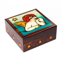The lid of this beautiful wooden box is decorated with a cherub design.
&#8203;Size is approx 6" x 6" x 2.5"