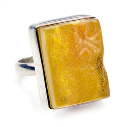 Natural semi-polished amber in a sterling silver frame.  The surface of the amber has been lightly polished so as to retain its natural textured surface.  Size is approx .8" x .7".  Only one ring available.