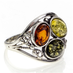 Gorgeous artistic three stone amber ring. Setting size is approx .75" x .6"