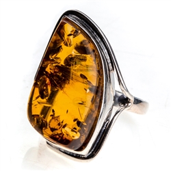 Honey colored amber and sterling silver ring. Size approx.  1.25" x .75".