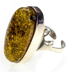 Oval Amber Ring Size 10 ring set in sterling silver.  Adjustable one time.  Ring size is approx 1.4" x .75".