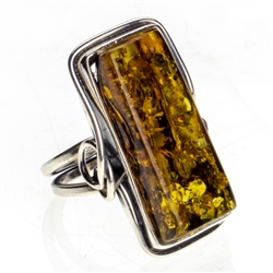 Beautiful rectangular shaped amber cabochon set in sterling silver. Size approx 1" x .5"