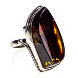 Dark cognac colored amber and sterling silver ring. Size approx. .75" x 1.25".