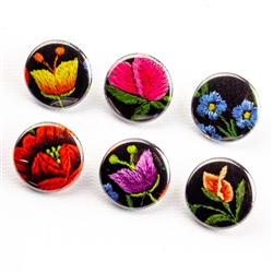 These small pinback buttons are bright and colorful, featuring traditional Polish folk designs on a black background. We make these buttons in house, a Polish Art Center exclusive! Set of 6 buttons.