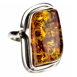 Honey colored amber cabochon framed in sterling. Size approx. 1" x .75".