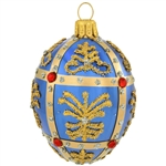 Simply egg-ceptional, this dazzling glass ornament was inspired by the famous jeweled eggs of the House of Faberge, in St. Petersburg, Russia. Featuring sparkling glitter folk patterns and glistening gold lines studded with sparkling red jewels, this
