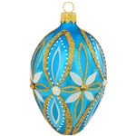 Elegant flowers in shimmering glitter designs decorate this lovely, azure blue egg. A mix of springtime splendor and festive Christmas charm, this beautiful blue, white and gold egg ornament is masterfully crafted of glass in Poland and measures 3" tall.