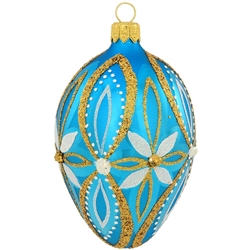 Elegant flowers in shimmering glitter designs decorate this lovely, azure blue egg. A mix of springtime splendor and festive Christmas charm, this beautiful blue, white and gold egg ornament is masterfully crafted of glass in Poland and measures 3" tall.
