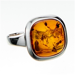 Classic looking .5" amber cabochon framed in sterling silver.