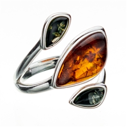 Artistic sterling silver ring highlighting three amber cabochons.  Size is approx 1" x .75".