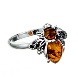 Silver and Amber honeybee resting on a sterling silver band.  Honeybee is approx .5" x .6".