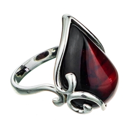 Cherry colored amber set in sterling silver.  Cabochon size is approx .75" x .5"