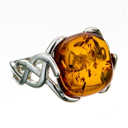 Artistic Celtic design silver and amber ring.  Cabochon size is approx .5" x .5".