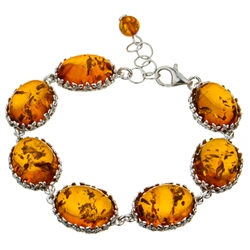 7 elegant oval amber cabochons each set with sparkling sterling. 7.5" long and adjustable smaller.