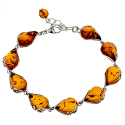 9 elegant drops of amber each set in sterling silver. Bracelet length is 7.5" and adjustable smaller.