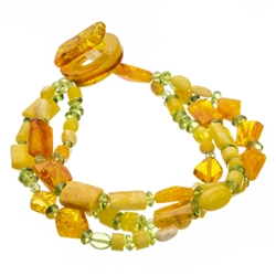 Bozena Przytocka is a designer of artistic amber jewelry based in Gdansk, Poland. Here is a stunning example of her use of amber and peridot to create a beautiful and unique bracelet. Includes faceted amber beads.