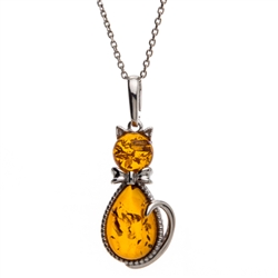 Sterling silver and amber kitty cat. Pendant size is approx. 1.5" x .6".