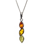 Sterling silver frames suround these three drops of amber in three colors. Pendant size is approx. 1.5" L  x .25" W.