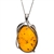 Artistic Sterling silver frames a beautiful honey amber cabochon drop. Cabochon size is approx. 1.25" x 1".