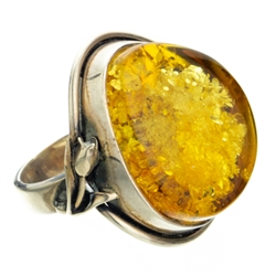 &#8203;A beautiful amber cabochon framed in a classic sterling silver frame. Size is approx 1.25 x  1.1".&#8203;  Fits size 7 and can be adjusted one time to size 8.