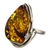 A beautiful amber cabochon framed in a classic sterling silver frame. Size is approx 1.25" x .75".
