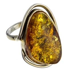 A beautiful amber cabochon framed in a classic sterling silver frame. Size is approx 1.25" x .75".