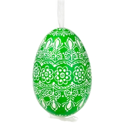 This beautifully designed egg is dyed one color, then white wax is melted and applied to form an intricate design which is left on the surfce. The egg is emptied and strung with ribbon for hanging.