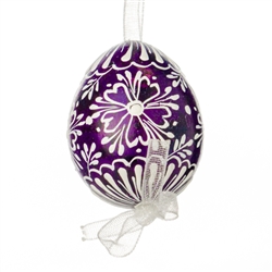 This beautifully designed quail egg is dyed one color, then white wax is melted and applied to form an intricate design which is left on the surface. Please note that quail eggs shells are naturally speckled brown and black and the black surfaces remain