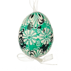 This beautifully designed quail egg is dyed one color, then white wax is melted and applied to form an intricate design which is left on the surface. Please note that quail eggs shells are naturally speckled brown and black and the black surfaces remain