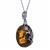 A beautiful honey amber cabochon framed in an open back sterling silver frame. Pendant size is approx. 1.1" x .9".