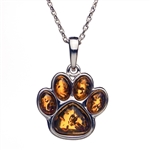 Paw shaped sterling silver and amber pendant. Pendant size is approx. .75: x .6".