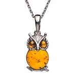 Sterling silver and honey amber owl. Pendant size is approx. .75" h x .5" w.