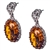 Gorgeous Baltic Amber earrings surrounded with a ring of Sterling Silver filigree work. Approx 1.2" long x .5" wide.