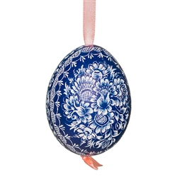 This beautifully designed chicken egg is dyed one color and the design scratched into the egg using a sharp knife. The technique is called "skrobanki" in Polish. The eggs have been emptied and strung through with ribbon for hanging. No two eggs are exactl