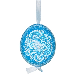 This beautifully designed chicken egg is dyed one color and the design scratched into the egg using a sharp knife. The technique is called "skrobanki" in Polish. The eggs have been emptied and strung through with ribbon for hanging. No two eggs are exactl