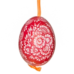 This beautifully designed chicken egg is dyed one color and the design scratched into the egg using a sharp knife. The technique is called "skrobanki" in Polish. The eggs have been emptied and strung through with ribbon for hanging. No two eggs are exactl