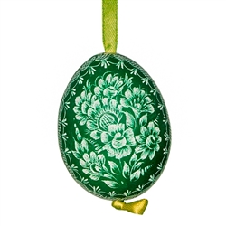 This beautifully designed chicken egg is dyed one color and the design scratched into the egg using a sharp knife. The technique is called "skrobanki" in Polish. The eggs have been emptied and strung through with ribbon for hanging. No two eggs are exactl