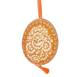 This beautifully designed chicken egg is dyed one color and the design scratched into the egg using a sharp knife. The technique is called "skrobanki" in Polish. The eggs have been emptied and strung through with ribbon for hanging. No two eggs are exactl