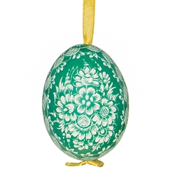 This beautifully designed chicken egg is dyed one color and the design scratched into the egg using a sharp knife. The technique is called "skrobanki" in Polish. The eggs have been emptied and strung through with ribbon for hanging. No two eggs are exactl