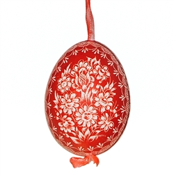 This beautifully designed chicken egg is dyed one color and the design scratched into the egg using a sharp knife. The technique is called "skrobanki" in Polish. The eggs have been emptied and strung through with ribbon for hanging. No two eggs are exactl