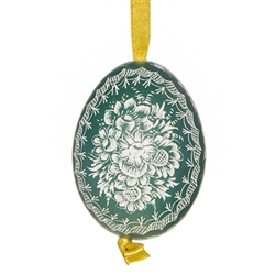 This beautifully designed chicken egg is dyed one color and the design scratched into the egg using a sharp knife. The technique is called "skrobanki" in Polish. The eggs have been emptied and strung through with ribbon for hanging. No two eggs are exactl