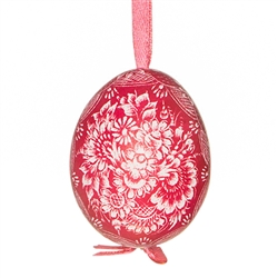 This beautifully designed chicken egg is dyed one color and the design scratched into the egg using a sharp knife. The technique is called "skrobanki" in Polish. The eggs have been emptied and strung through with ribbon for hanging. No two eggs are exactl