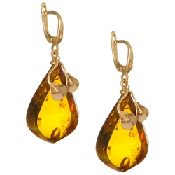 Honey amber earrings set in 14kt gold with calla lily detail. Stylish and unique. Size is approx 1.5" x .75"