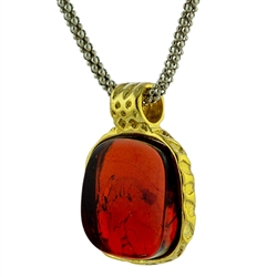 Gold plate over silver pendant with a cherry amber cabachon. Adjustable 16" - 18" sterling silver rope chain. Pendant is .5" x .5".