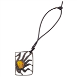 Artistic amber pendant/charm set in a metal frame. We string these on a 4" removable leather cord.  These are hand made so the design will vary slightly.  Frame size is approx 1.75" x 1.25'.